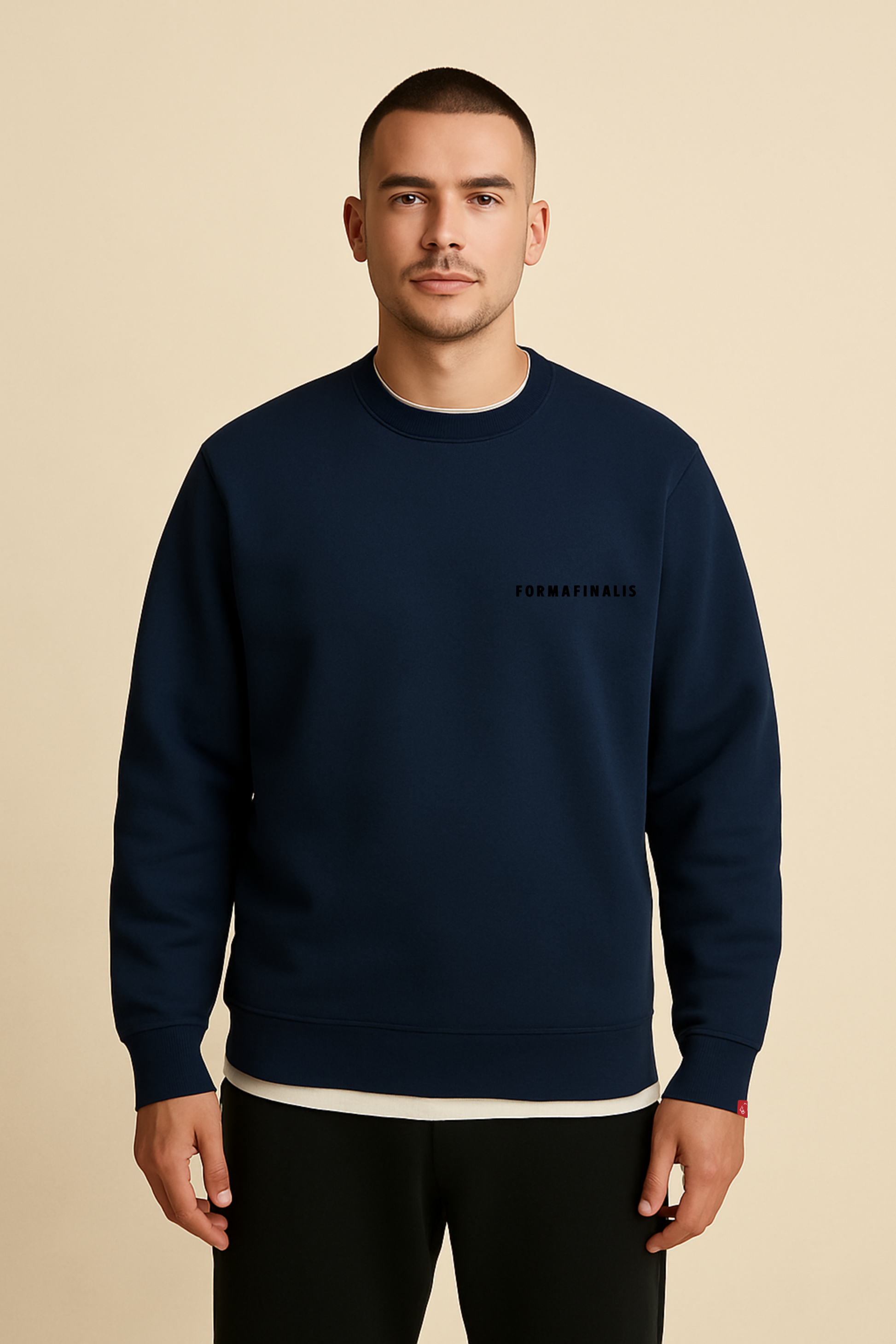 Model wears FF Capsule Heavy-weight Cotton Crew Neck Sweatshirt in Navy.  FormaFinalis tonal embroidery wordmark with discreet embroided tiger head logo tag on sleeve. 