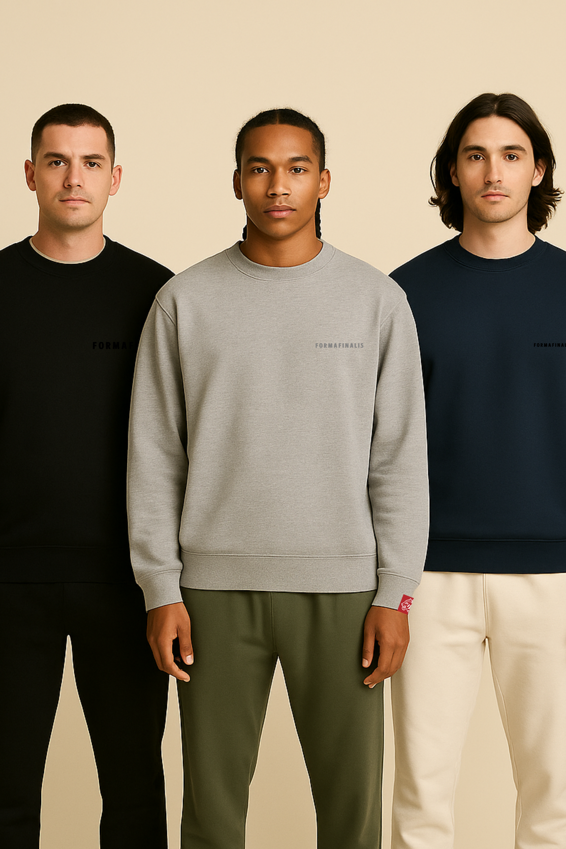 From left to right. Model wears FF Capsule Heavy-weight Cotton Crew Neck Sweatshirt in black, Heather Grey and Navy.  FormaFinalis tonal embroidery wordmark with discreet embroided tiger head logo tag on sleeve. 