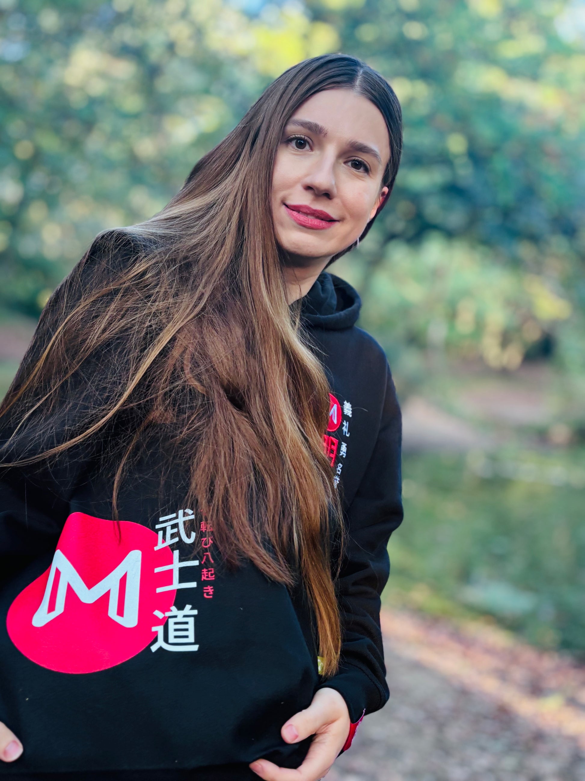 Model wears Bushido hoodie accompanied with Ikigai Tote 