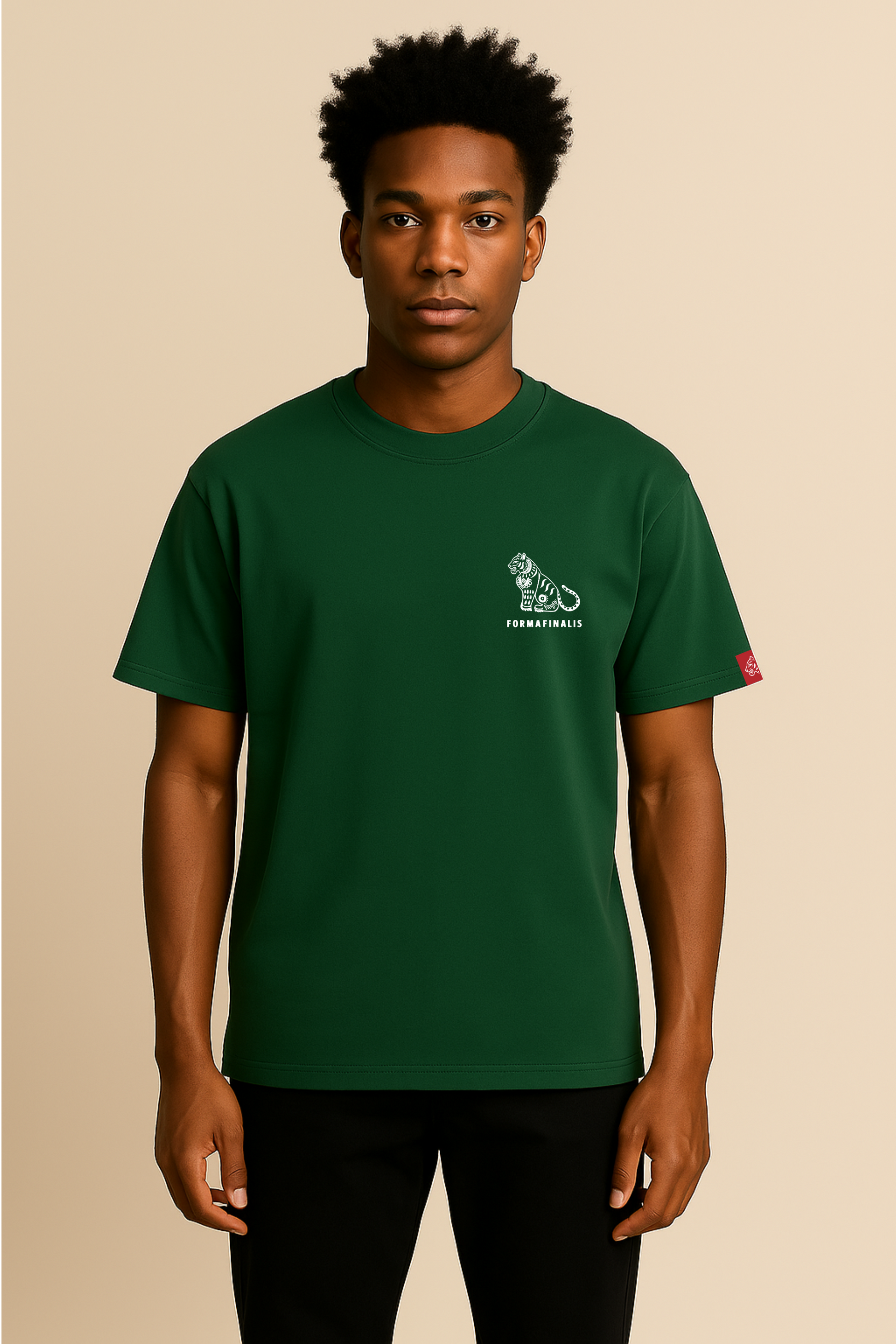 Model wears Tiger Signature Everyday Tee in Bottle Green.  Mid- weight 180GSM organic cotton, fits true to size.  Built for everyday comfort and movement. Ideal as a standalone or for layering.  Embroided Tiger Logo on sleeve. 