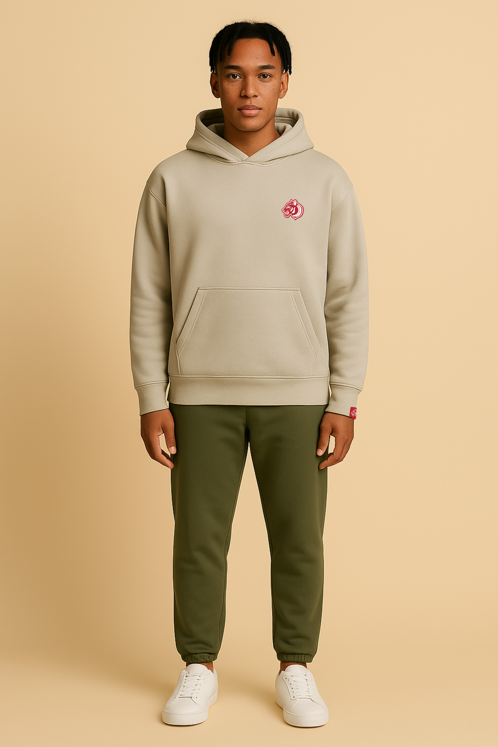 Model wears Heavy weight relaxed fit hoodie in stone.  440GSM heavy weight cotton rich with brushed fleece inner lining.  Embroidered FormaFinalis classic tiger crest front chest.  FormaFinalis word mark on back.