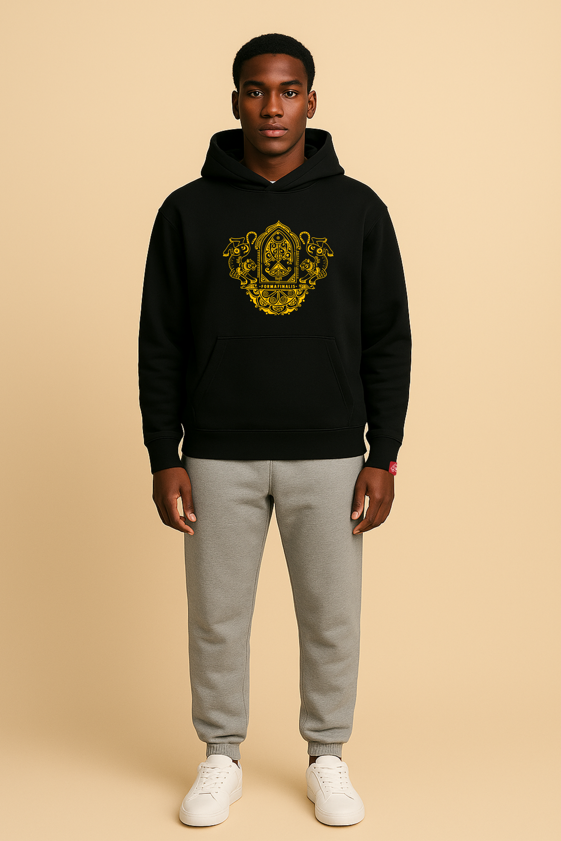 Model wears Heavy Weight Cotton Hoodie with large embroidered ornate  twin tiger motif on front, discreet FormaFinalis word mark embroidered on back.   Black hoodie with gold embroidery