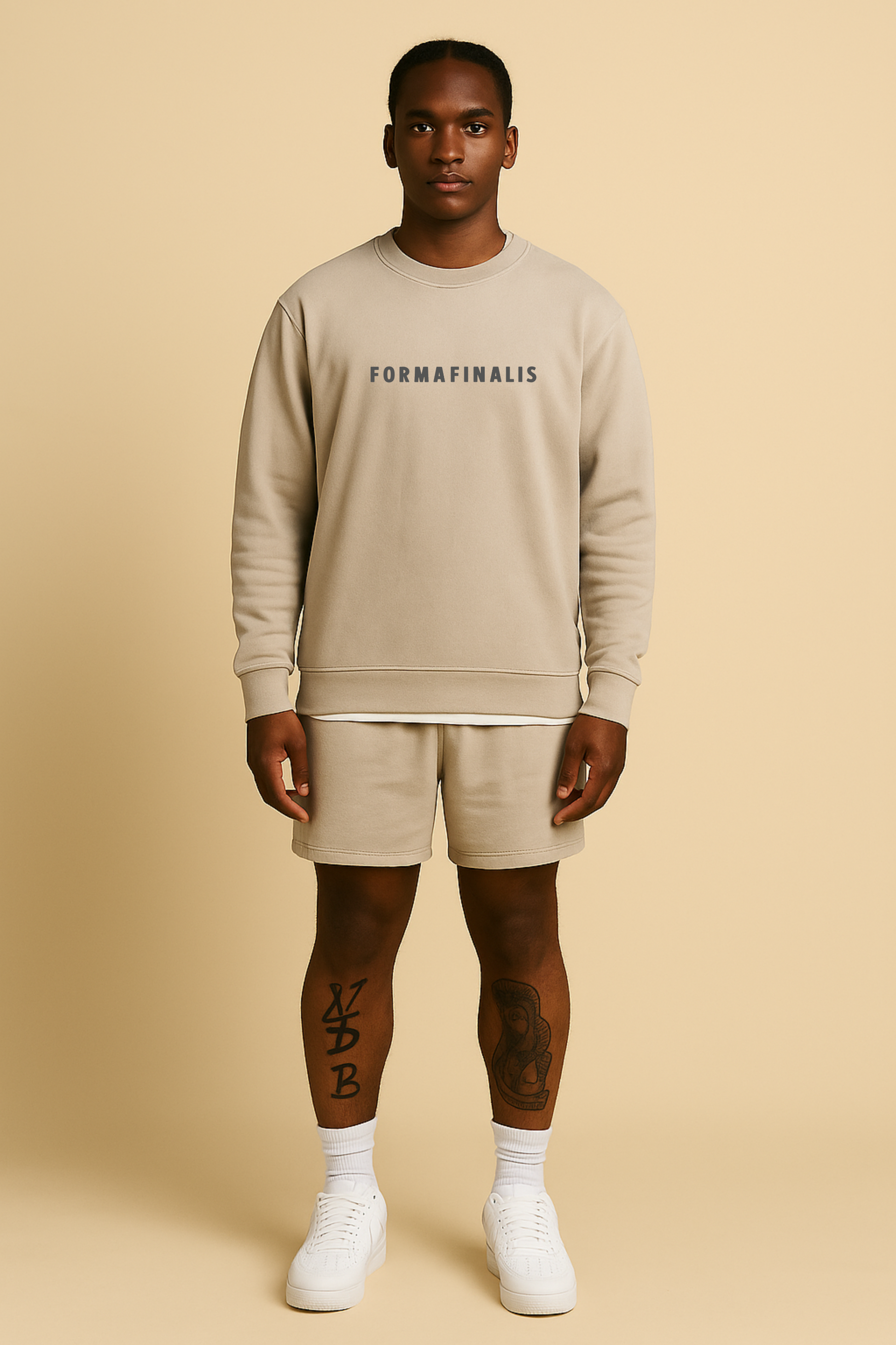 Relax Faded Track Shorts 18″ in Faded Bone on model — relaxed fit, 320 GSM midweight fleece with elastic waistband. 80% Cotton 20% Recycled Polyester.  Monoblock pairing with SS25 Pause Tape Relax Crew in Faded Bone. 