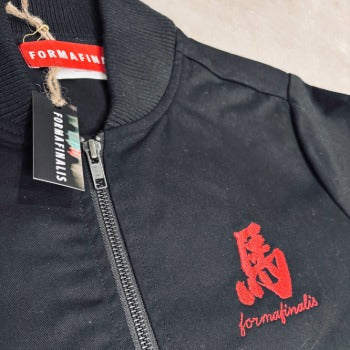 Detail shot of tonal YKK zip, detailed embroidery and ribbed collar on 170GSM cotton drill jacket